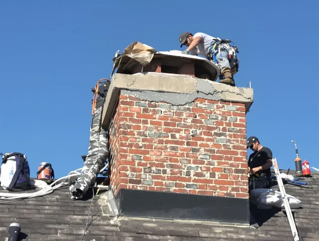 Fairfield Chimney Sweep installing a custom chimney crown in Fairfield, CT