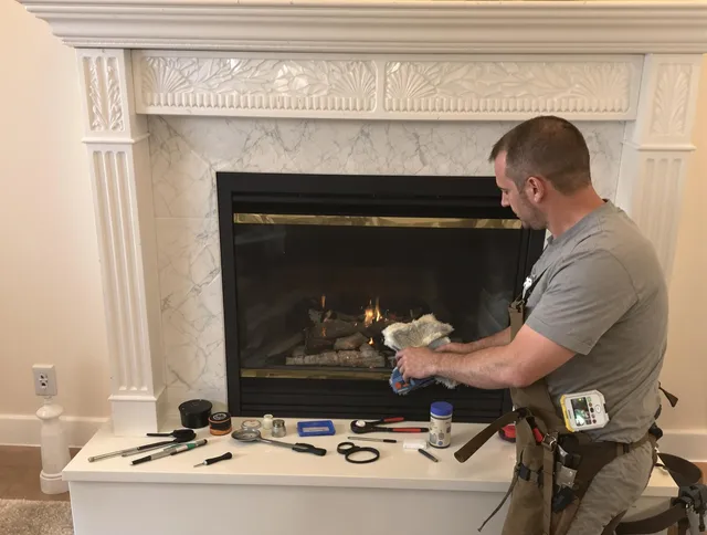 Fairfield Chimney Sweep performing fireplace maintenance in Fairfield, CT