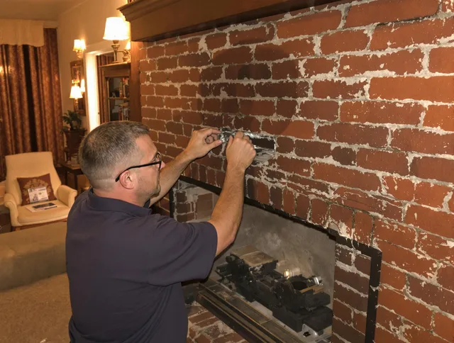 Fairfield Chimney Sweep expert fixing a fireplace in Fairfield, CT